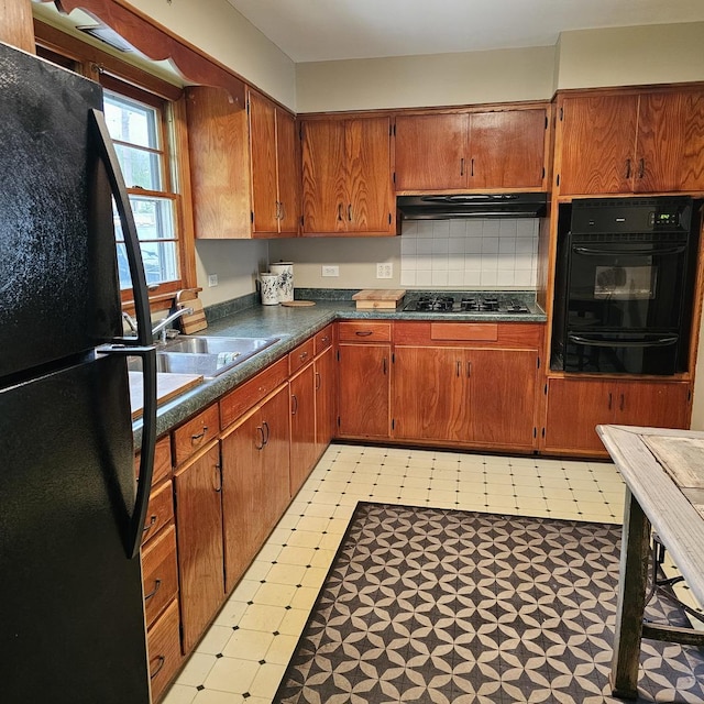 6 Johnson St, East Dundee, IL 60118 - kitchen featuring black appliances, light flooring, a warming drawer, under cabinet range hood, and dark countertops