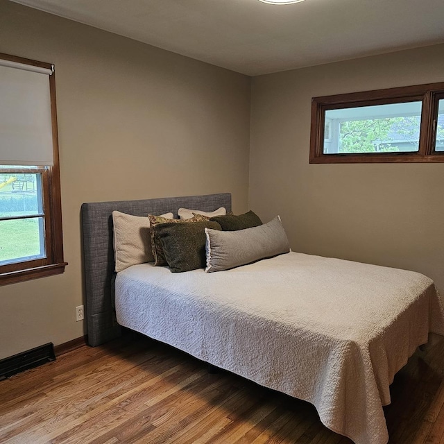 6 Johnson St, East Dundee, IL 60118 - bedroom featuring multiple windows, wood finished floors, and baseboards