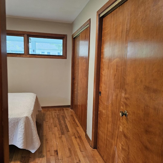 6 Johnson St, East Dundee, IL 60118 - bedroom featuring multiple closets, wood finished floors, and baseboards