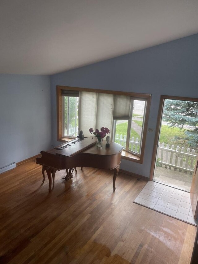 11011 W Roosevelt Rd, Westchester, IL 60154 - office featuring vaulted ceiling, wood finished floors, and healthy amount of natural light