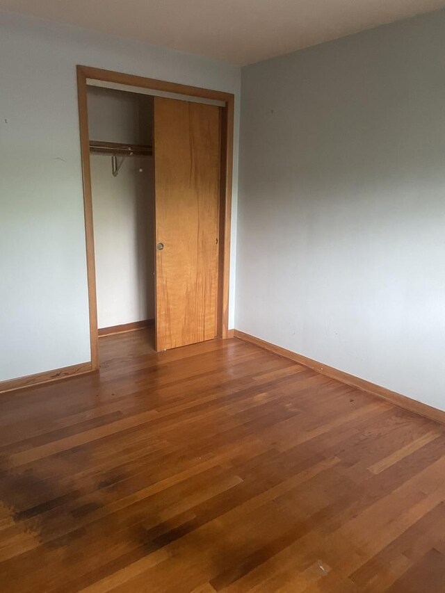 11011 W Roosevelt Rd, Westchester, IL 60154 - unfurnished bedroom featuring a closet and wood finished floors