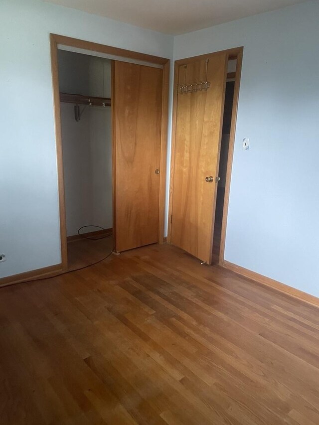 11011 W Roosevelt Rd, Westchester, IL 60154 - unfurnished bedroom with light wood-style flooring and a closet