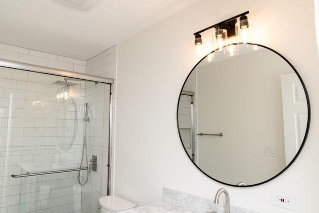 906 Central Park Dr, Round Lake Beach, IL 60073 - full bath featuring a stall shower, toilet, and vanity