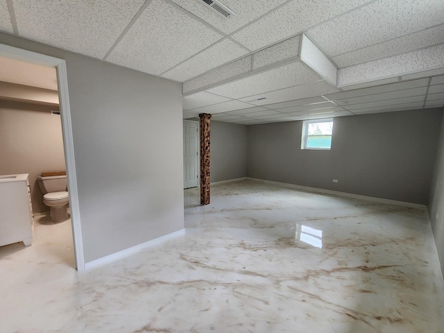 906 Central Park Dr, Round Lake Beach, IL 60073 - below grade area with a paneled ceiling and baseboards
