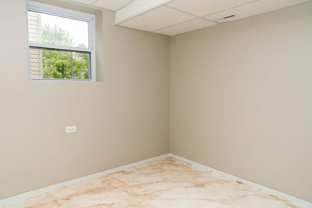 906 Central Park Dr, Round Lake Beach, IL 60073 - spare room with a drop ceiling and baseboards