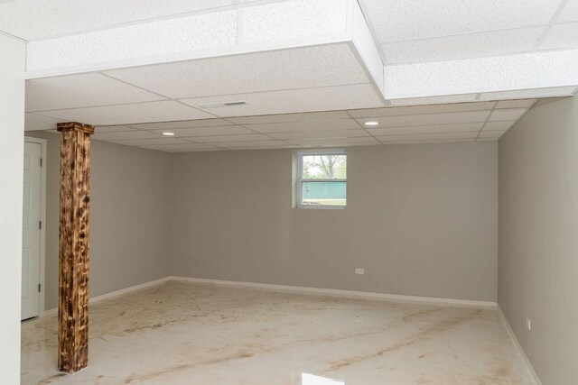 906 Central Park Dr, Round Lake Beach, IL 60073 - basement featuring baseboards and a drop ceiling
