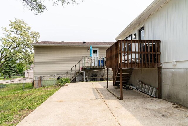 906 Central Park Dr, Round Lake Beach, IL 60073 - rear view of property featuring stairway, a wooden deck, and a patio area