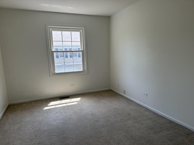 2S809 Grove Ln, Warrenville, IL 60555 - empty room with carpet floors and baseboards