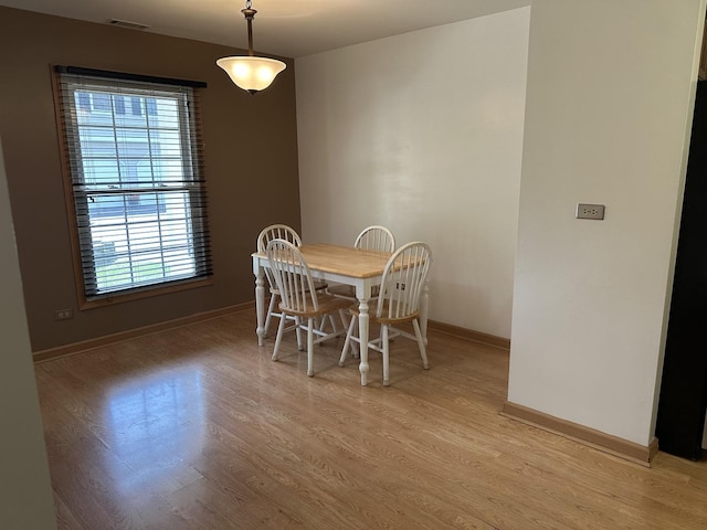 2S809 Grove Ln, Warrenville, IL 60555 - dining room featuring plenty of natural light, baseboards, and light wood-style floors