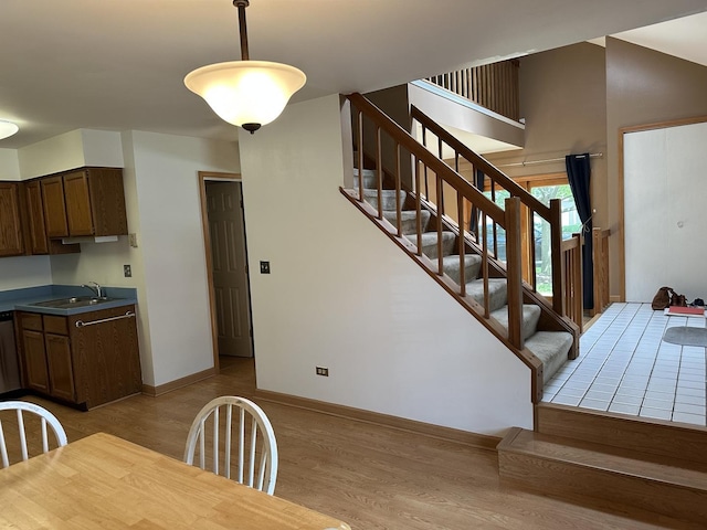 2S809 Grove Ln, Warrenville, IL 60555 - dining room with light wood finished floors, stairs, and baseboards