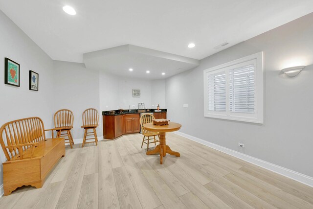 610 Greendale Rd, Glenview, IL 60025 - kitchen with dark countertops, light wood finished floors, recessed lighting, baseboards, and a sink