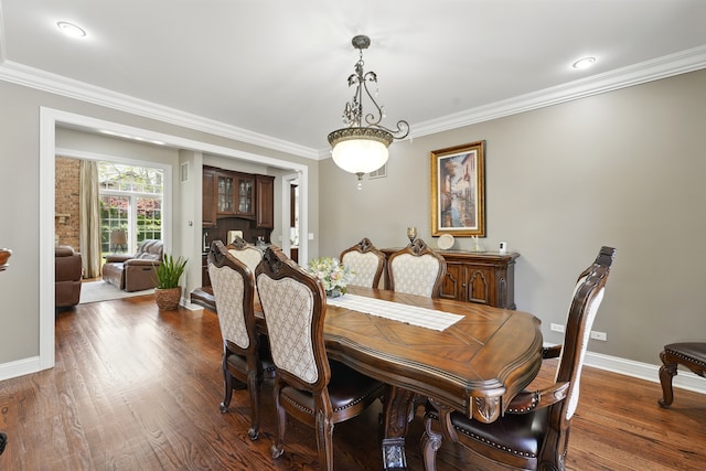 610 Greendale Rd, Glenview, IL 60025 - dining space with ornamental molding, dark wood-style floors, and baseboards