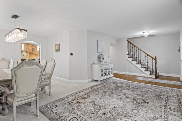 1086 Brighton Dr, Carol Stream, IL 60188 - dining space featuring baseboards, stairway, and arched walkways