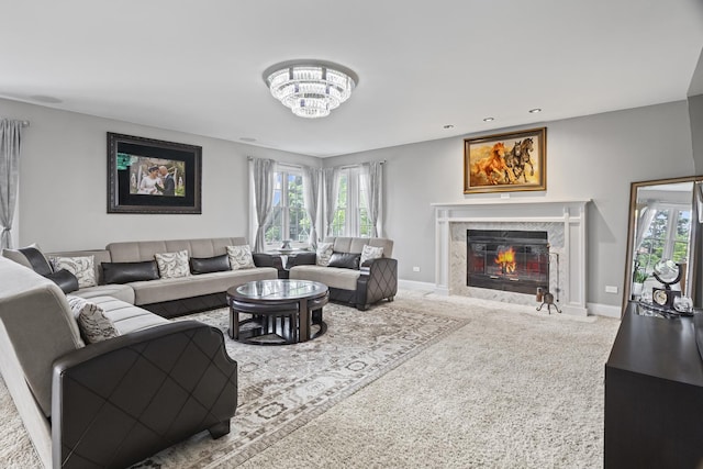 1086 Brighton Dr, Carol Stream, IL 60188 - carpeted living area featuring healthy amount of natural light, a high end fireplace, a chandelier, and baseboards