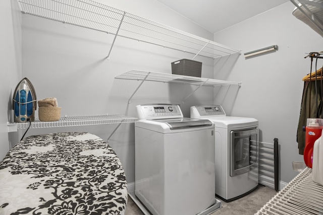 1086 Brighton Dr, Carol Stream, IL 60188 - laundry area featuring washer and clothes dryer, light colored carpet, and baseboards