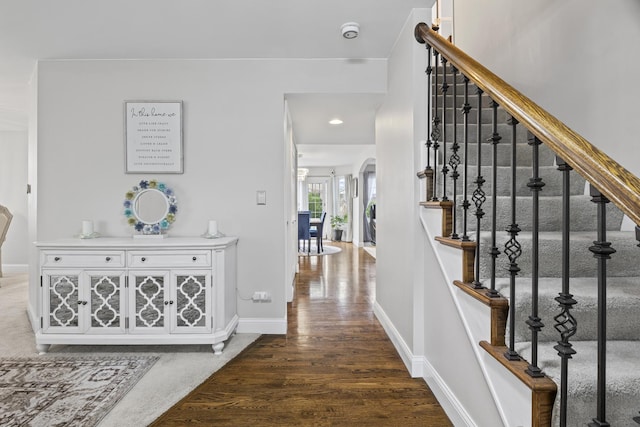 1086 Brighton Dr, Carol Stream, IL 60188 - entrance foyer with stairway, baseboards, wood finished floors, arched walkways, and recessed lighting
