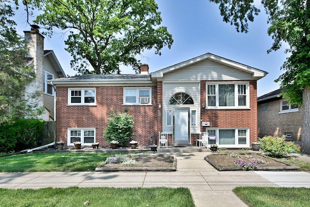 2808 Struckman Ave, River Grove, IL 60171 - bi-level home featuring brick siding, a front yard, and a chimney