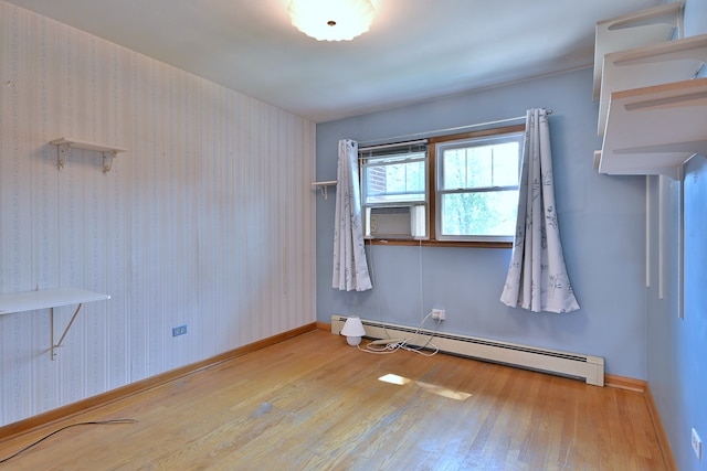 2808 Struckman Ave, River Grove, IL 60171 - spare room featuring a baseboard heating unit, wood-type flooring, and cooling unit