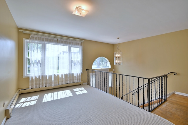 2808 Struckman Ave, River Grove, IL 60171 - hallway featuring a chandelier, an upstairs landing, wood finished floors, and a baseboard radiator