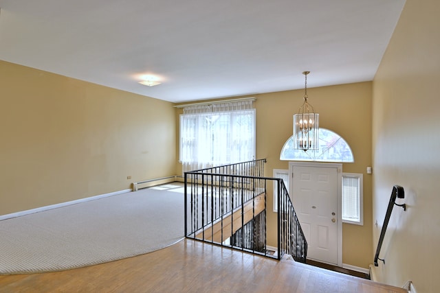 2808 Struckman Ave, River Grove, IL 60171 - entrance foyer with a chandelier, baseboard heating, and wood finished floors