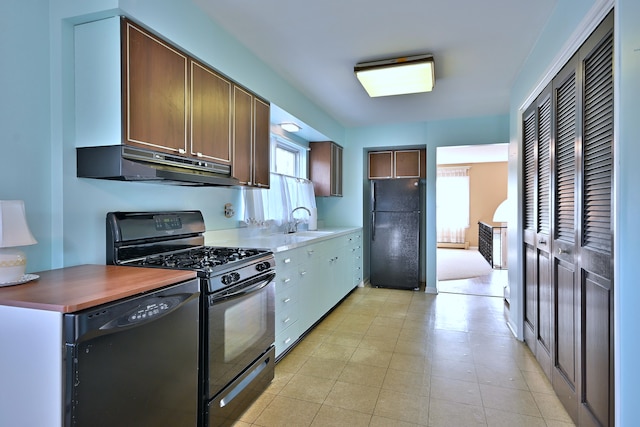 2808 Struckman Ave, River Grove, IL 60171 - kitchen featuring black appliances and under cabinet range hood