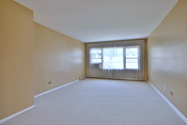 2808 Struckman Ave, River Grove, IL 60171 - spare room with light carpet and a baseboard heating unit