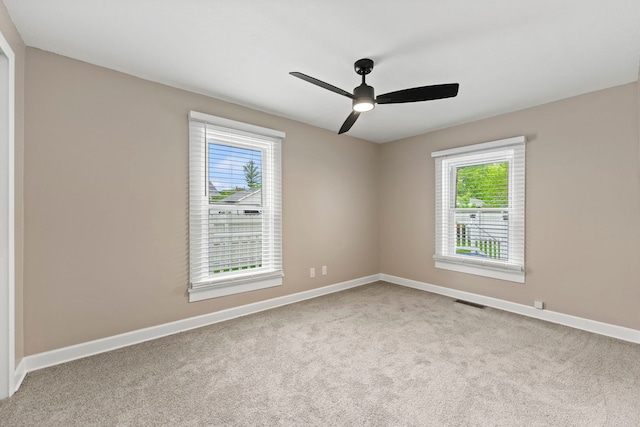 217 W Mazon Ave, Dwight, IL 60420 - carpeted spare room with plenty of natural light, baseboards, and a ceiling fan