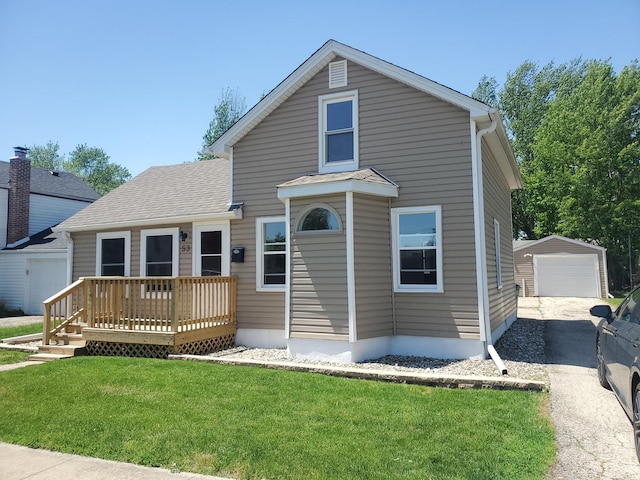 53 N Walnut St, Manteno, IL 60950 - traditional-style home with an outdoor structure, a garage, a deck, and a front yard