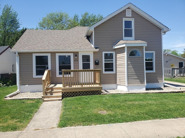 53 N Walnut St, Manteno, IL 60950 - traditional-style house featuring a front lawn, roof with shingles, and a deck