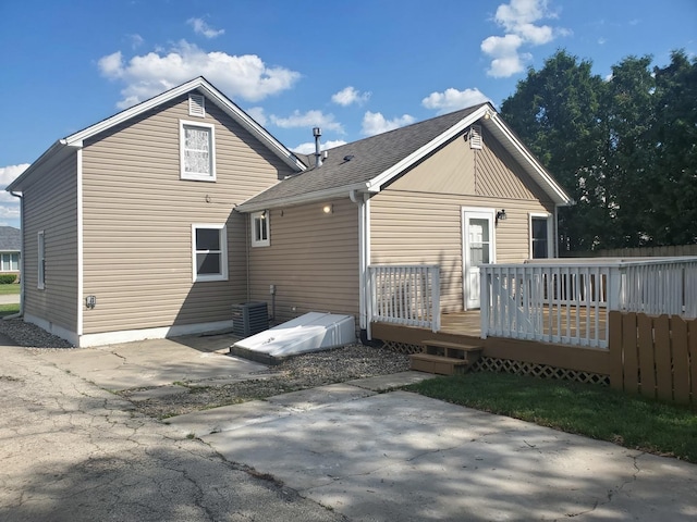 53 N Walnut St, Manteno, IL 60950 - rear view of house with a patio area, a deck, roof with shingles, and central AC