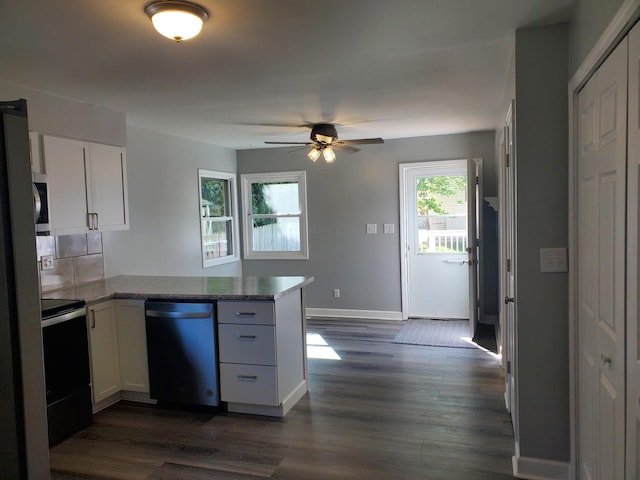 53 N Walnut St, Manteno, IL 60950 - kitchen featuring appliances with stainless steel finishes, a peninsula, white cabinetry, and a ceiling fan