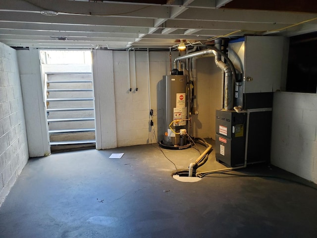 53 N Walnut St, Manteno, IL 60950 - basement featuring water heater, concrete block wall, and heating unit