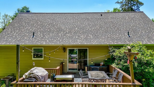 2655 N 3853rd Rd, Sheridan, IL 60551 - rear view of property featuring a shingled roof, a deck, and outdoor dining space