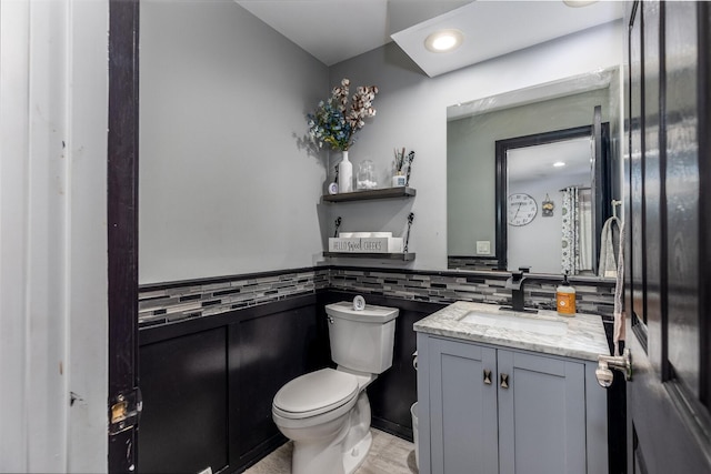 2655 N 3853rd Rd, Sheridan, IL 60551 - bathroom featuring toilet, vanity, a wainscoted wall, and recessed lighting