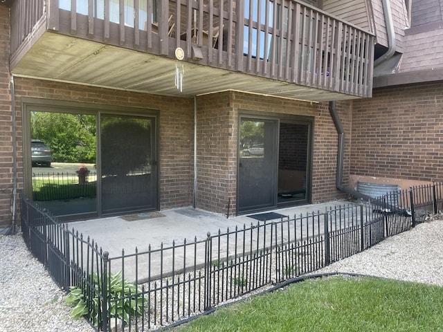 1616 Richmond Cir Unit 101, Joliet, IL 60435 - view of patio featuring a balcony