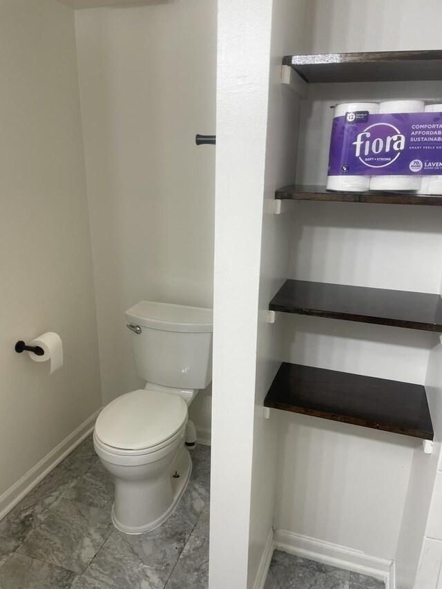 1616 Richmond Cir Unit 101, Joliet, IL 60435 - bathroom with baseboards and toilet