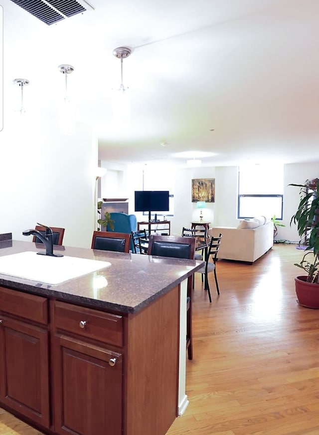 910 S Michigan Ave Unit 1805, Chicago, IL 60605 - kitchen with open floor plan, light wood finished floors, and a kitchen island