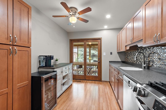 9254 Windsor Pkwy, Tinley Park, IL 60487 - kitchen featuring a sink, stainless steel appliances, wine cooler, dark countertops, and tasteful backsplash