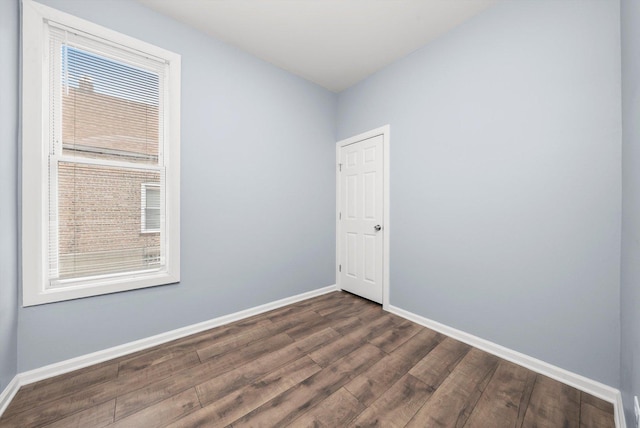 5635 S May St, Chicago, IL 60621 - empty room with dark wood-type flooring and baseboards