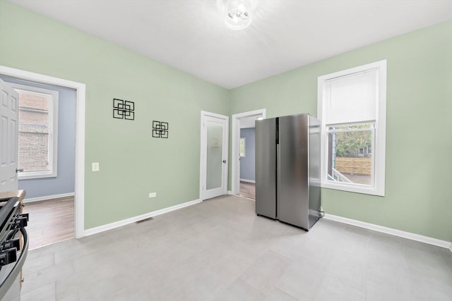 5635 S May St, Chicago, IL 60621 - unfurnished bedroom featuring freestanding refrigerator and baseboards