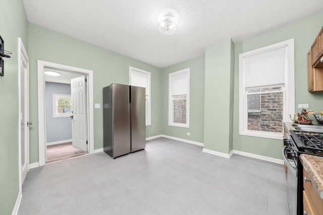5635 S May St, Chicago, IL 60621 - kitchen with appliances with stainless steel finishes, baseboards, and light countertops
