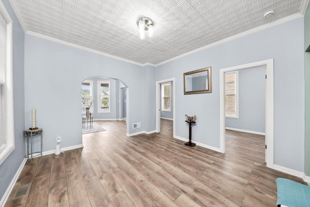 5635 S May St, Chicago, IL 60621 - unfurnished room with arched walkways, wood finished floors, an ornate ceiling, baseboards, and ornamental molding