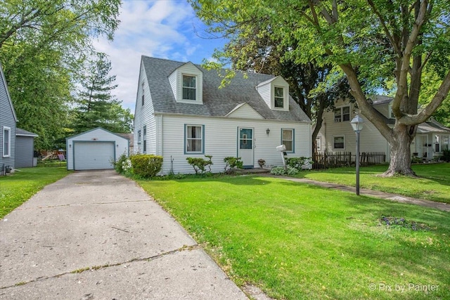 510 S Alfred Ave, Elgin, IL 60123 - cape cod home featuring an outbuilding, a detached garage, a shingled roof, and driveway