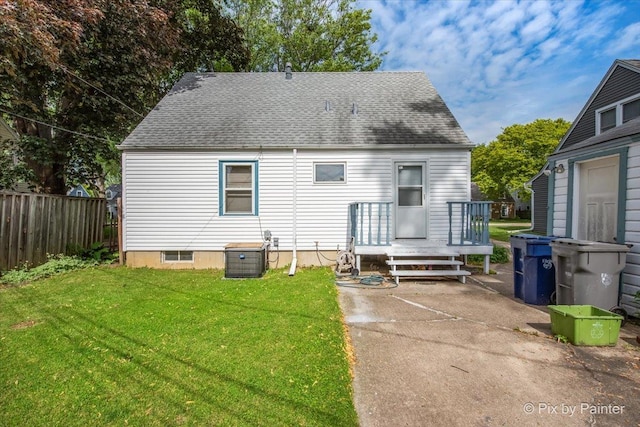 510 S Alfred Ave, Elgin, IL 60123 - rear view of house featuring a shingled roof and a patio area