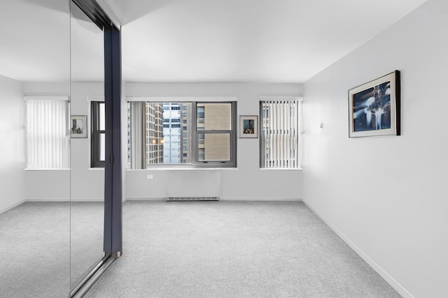 247 E Chestnut St Unit 1102, Chicago, IL 60611 - carpeted spare room featuring baseboards
