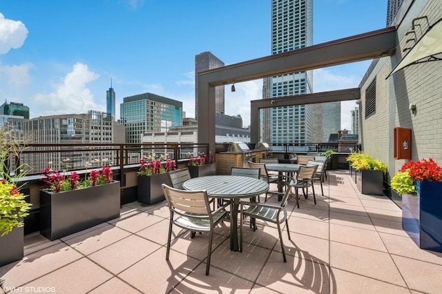 247 E Chestnut St Unit 1102, Chicago, IL 60611 - view of patio featuring outdoor dining area and a view of city
