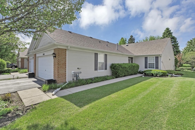 646 S Curran Rd, Round Lake, IL 60073 - ranch-style home featuring a garage, brick siding, a front lawn, driveway, and a shingled roof
