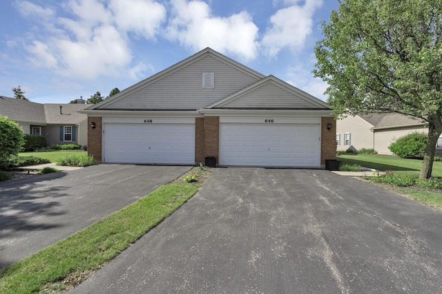 646 S Curran Rd, Round Lake, IL 60073 - view of front facade with brick siding and driveway
