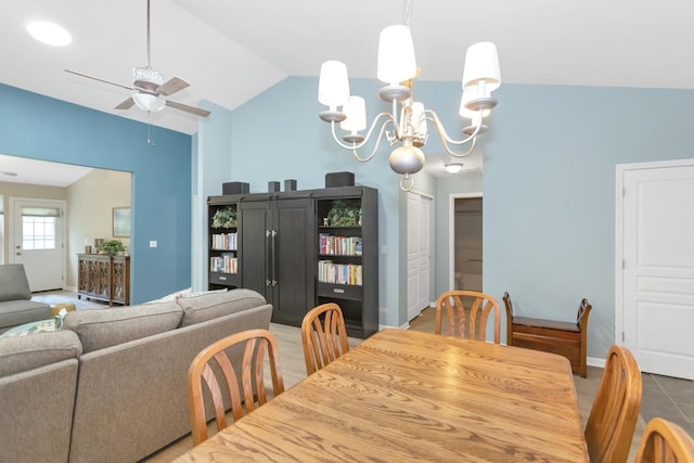 646 S Curran Rd, Round Lake, IL 60073 - dining area with lofted ceiling, a ceiling fan, baseboards, and a chandelier