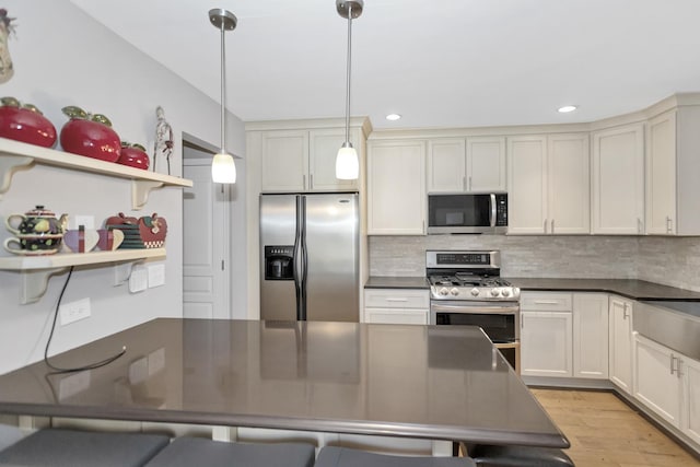 646 S Curran Rd, Round Lake, IL 60073 - kitchen featuring stainless steel appliances, dark countertops, decorative backsplash, and recessed lighting